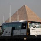 A damaged bus is seen at the site of a blast near a new museum being built close to the Giza...