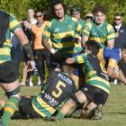 Taieri's Te-Korohi Rupene crashes through the Green Island defence to score during a Dunedin...