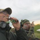 Tony Chadderton (left) and John Faul, both of Invercargill, attempt to entice ducks on the...