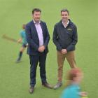 David Booth (left), from King's High School, and Andy McLean, from Otago Hockey, look to make...