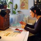 Little Constellation jewellery designer Maria Brett works on a pair of handcrafted earrings in...