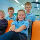 Enjoying the new classrooms are Cromwell Primary School pupils (from left) Grace Brenssell (10),...