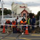Oamaru Steam and Rail Society volunteers work to prepare for the installation of sensors and...