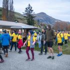 Participants in the ``Darkness Into Light'' walk arrive back at the Lake Hayes Pavilion near...