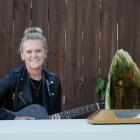 Musician Casey Dixon, of Kenmure, at home on Tuesday with her trophy for winning the supreme...