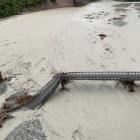 The Waiho Bridge was washed away in floodwaters on Tuesday. Photo: Doc


