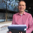 Central Otago District Council planning manager David Campbell holds the 2199-page agenda for the...