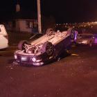A car rolled after hitting two parked cars in Calton Hill early this morning. Photo: Kris Campbell