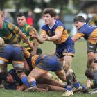 Taieri's Bob Martin clears the ball from a ruck against Green Island at Peter Johnstone Park on...