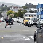 Traffic queues at the intersection of Clyde and Albany Sts yesterday, where a trial roundabout is...