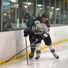 Jacob Hurring (left), of the Dunedin Thunder, is checked by Stephen Mawson, of the Botany Swarm,...