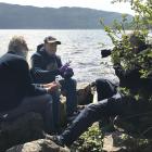 Neil Gemmell (centre) on the shores of Loch Ness. PHOTO: Supplied 