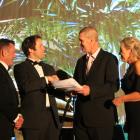 Blair and Melissa Vining hand over a petition to MPs Michael Woodhouse (left) and Hamish Walker,...