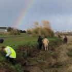 The rainy weather didn't deter volunteers from collecting rubbish along the Waihopai River banks...