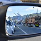 A log truck rumbles through the main street of Port Chalmers on its way to Port Otago's wharf....