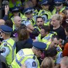 Police andclimate action demonstrators in the thick of protest action at the Dunedin Town Hall...