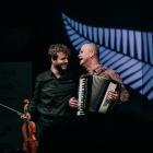 Matthias Well (left), of Germany, shares a laugh with Queenstown musician Mark Wilson on stage...