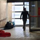 Fast asleep, wrapped tightly in blankets in the entrance to the Westpac building in George St,...