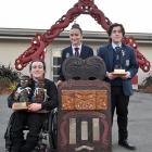 Displaying their well-earned trophies are three of the nga toa whakaihu waka o Nga Manu Korero...