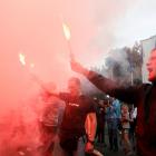 The death sparked protests outside the Interior Ministry building by people who lit flares and...
