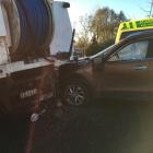 An SUV crashed into a parked work truck in Balclutha this morning. Photo: Richard Davison