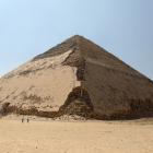 People walk in front of the Bent Pyramid of Sneferu, that was reopened after restoration work, in...