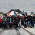 Middlemarch locals take their first steps across the new road bridge near Sutton after it was...