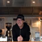 Classic Cafe owner Chris Baker keeps the beans fresh for passengers at the bus hub. Photo: Peter...