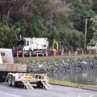 Contractors fix a water leak in Careys Bay on Saturday. PHOTO: GREGOR RICHARDSON