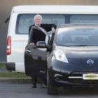 Auto Court staff Bob Woodford (left) with a 2013 Nissan Leaf, and Colin Dick with a 2008 Toyota...