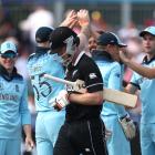 James Neesham looks dejected as he walks off after losing his wicket as England's Mark Wood...