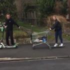 The young man rode a Lime scooter and towed a supermarket trolley behind him while a young woman on a skateboard held on to the back of the trolley. Screengrab: Gerard O'Brien