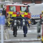 Army explosives experts remove an unstable chemical from a business premise in Glasgow St; South...