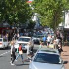 Boxing Day shoppers throng Dunedin at the corner of George and St Andrew Sts last year; local...