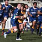 Otago's Slade McDowall runs the ball up against North Otago at Whitestone Contracting Stadium in...