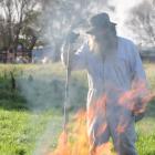 Southland commercial beekeeper Geoff Scott demonstrates what to do with an American foulbrood...