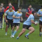 University hooker Ricky Jackson looks to take the ball up against Dunedin in a match at the...