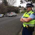 Senior Sergeant Jared Kirk watches motorists in Corstorphine Rd where a mobile speed-camera site...