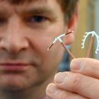 Associate Prof Mike Stitely, with IUDs. PHOTO: CRAIG BAXTER 