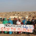 Saharawi refugees living in El-Aiun camp near Tindouf, in Algeria, protest against New Zealand's...