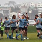 University players celebrate after winning their semifinal against Harbour at the University of...