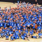 Youngsters and Steven Adams gather at a basketball camp held at ILT Stadium Southland yesterday....
