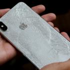 A worker refurbishes an Apple Iphone. Photo: Reuters