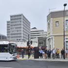 People wait at the bus hub in Great King St. PHOTO: GERARD O'BRIEN
