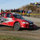 Dean Bond, of Balclutha, slides his Mitsubishi Evo 6.5 through the Romahapa corner during the...