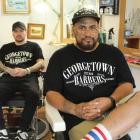 Fast-tracking success: Georgetown Barbers employee (left) Nate Walters with owner and friend Niko...