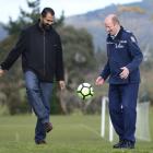 Otago Muslim Association president Dr Mohammed Rizwan (OMA United, left) kicks a ball around with...