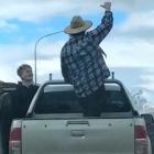 Queenstown police are trying to track down the occupants of a ute, one of whom climbed out of it while it was moving, after a video of the incident was posted on social media. Screengrab: Supplied 