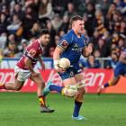 Otago's Dylan Nel runs away from Southland's Moses Faletolu to score during the Ranfurly Shield...