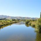 The Pomahaka River looking downstream from a bridge on State Highway 90 between Tapanui and...